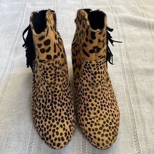 Falchi calf hair animal print wedge bootie with fringe detail.